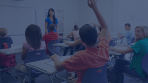 Students in classroom raising hand. Harmful Language in schools webinar with Dr. Angie Barfield