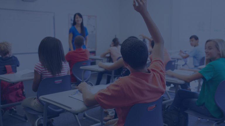 Students in classroom raising hand. Harmful Language in schools webinar with Dr. Angie Barfield